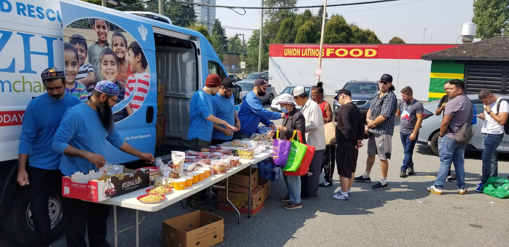 Vancouver, Canada - Participating in Mobile Food Rescue Program by Serving Hot Meals, Snacks, Cold Drinks & Distributing Essential Groceries to Local Community's Less Privileged People