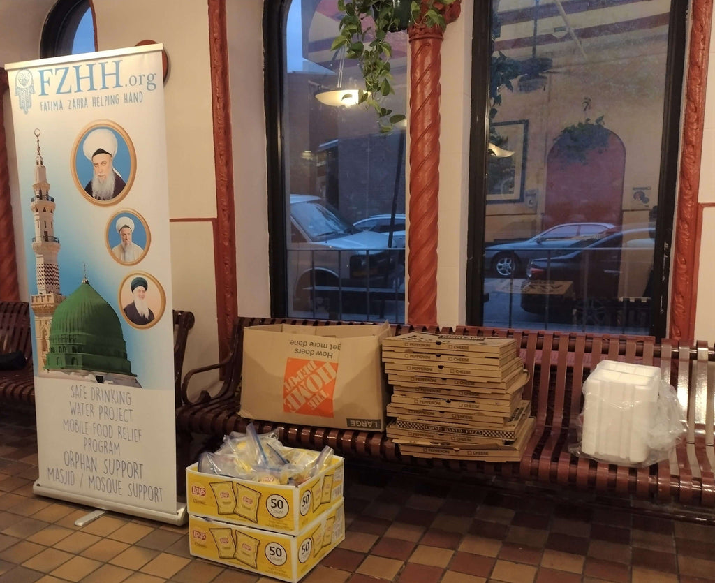 Distributing Pizza & Goodie Bags to our Homeless & Mentally Challenged – CHI