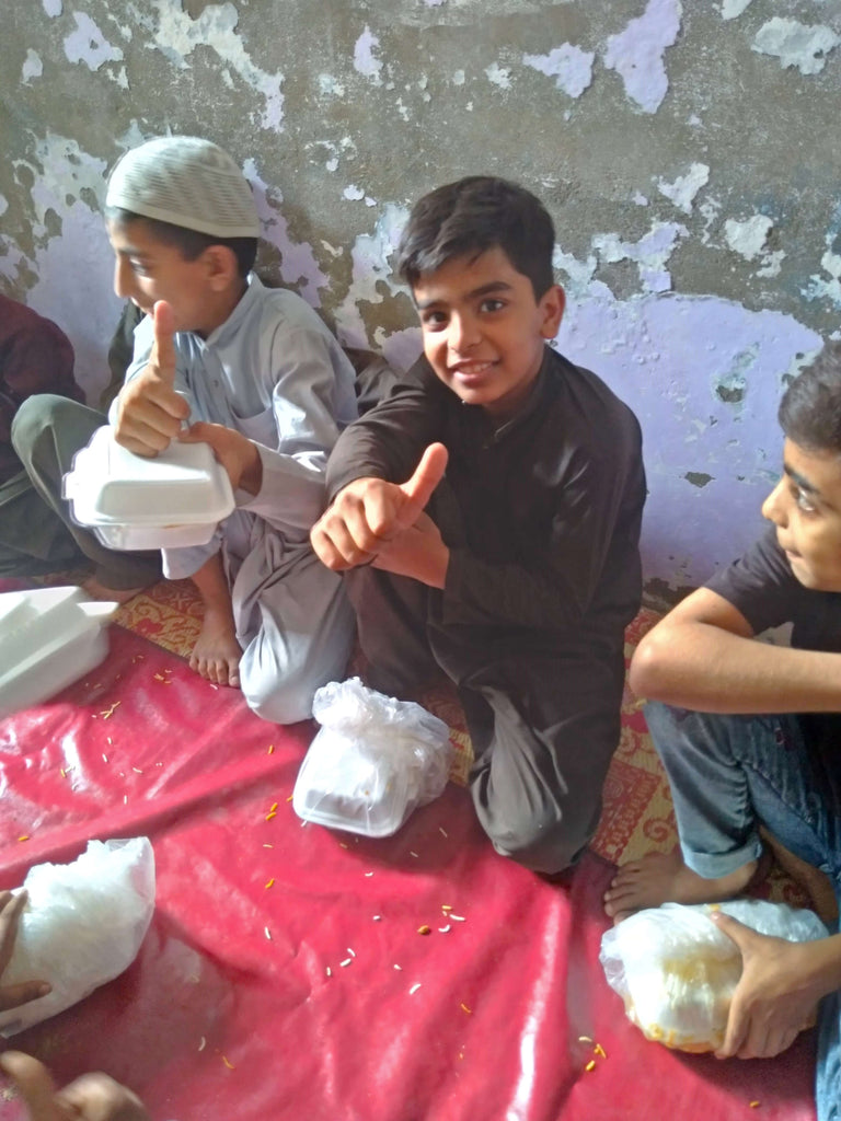 Karachi, Pakistan - Participating in Our Mobile Food Rescue Program & Orphan Support Programs by Serving Hot Meals & Distributing Goodie Bags Filled with Snacks, Candies & Toys to 60+ Beloved Orphans at Local Community's Orphanage