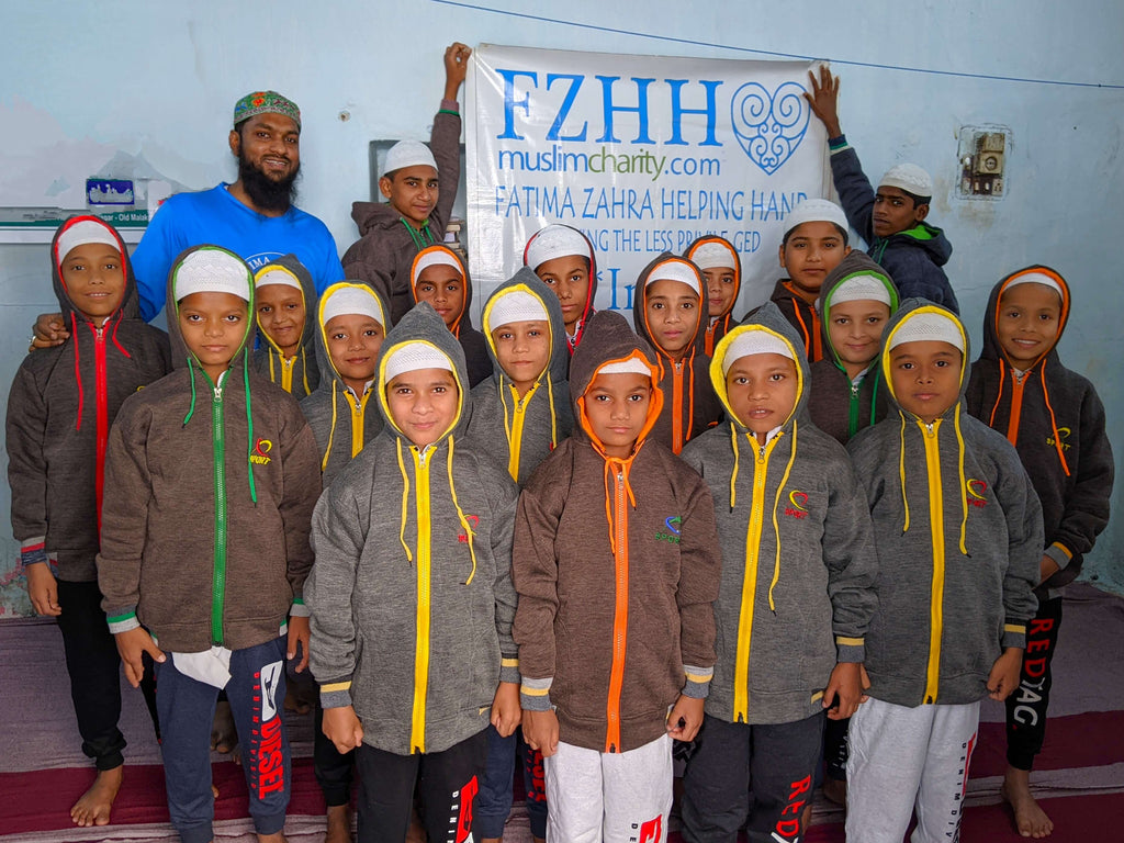 Hyderabad, India - Participating in Mobile Food Rescue Program by Distributing Warm Winter Apparel to 50+ Less Privileged Children & Elderly People