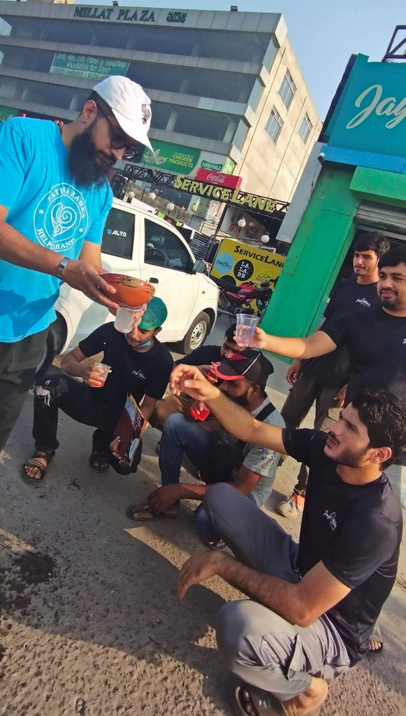 Lahore, Pakistan - Participating in Mobile Food Rescue Program by Distributing Naan, Halwa, and Chilled Rooh Afza to 100+ Less Privileged Women, Men & Children