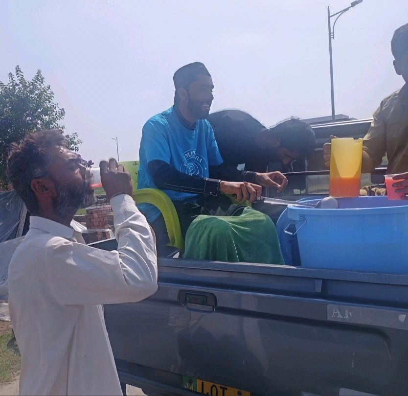 Lahore, Pakistan - Participating in Mobile Food Rescue Program by Distributing Cold Sweetened Water (Jame Shireen) to Less Privileged Children, Women & Men