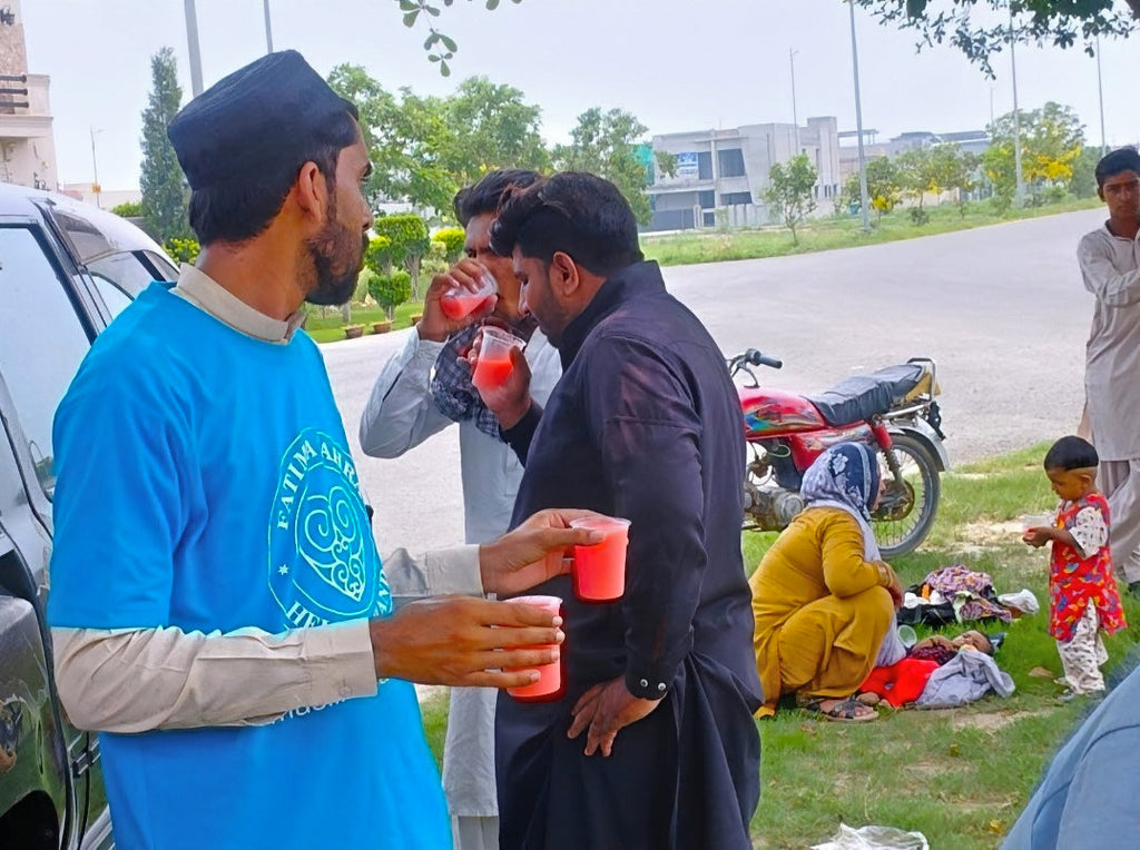 Lahore, Pakistan - Participating in Mobile Food Rescue Program by Distributing Cold Sweetened Water (Jame Shireen) to Less Privileged Children, Women & Men