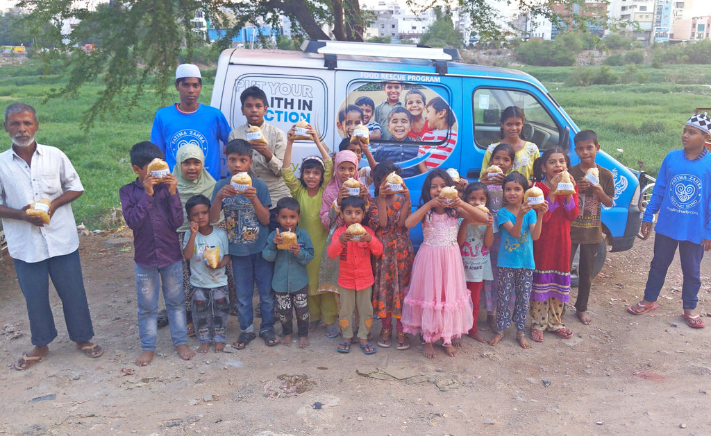 Hyderabad, India - Participating in Our Mobile Food Rescue Program by Preparing, Packaging & Distributing Hot Homemade Meals to 100+ Less Privileged Children & Families