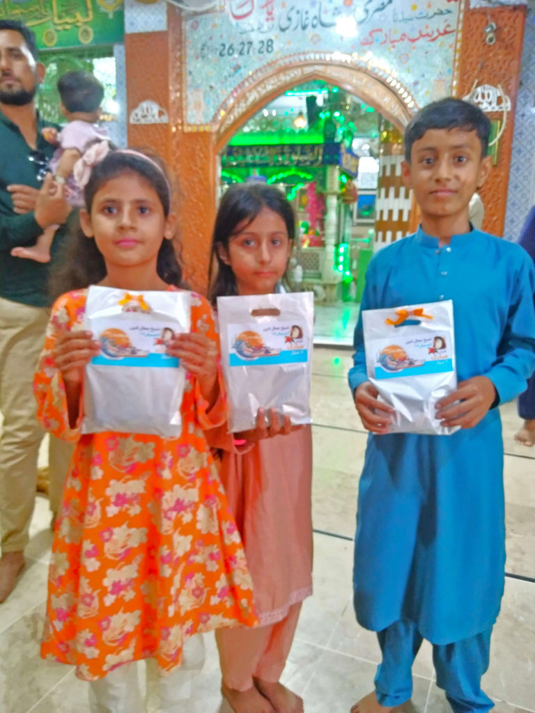 Karachi, Pakistan - Participating in Mobile Food Rescue Program by Distributing Goodie Bags Filled with Snacks, Chocolates & Candies to 60+ Less Privileged Children & Women at Local Community's Holy Shrine