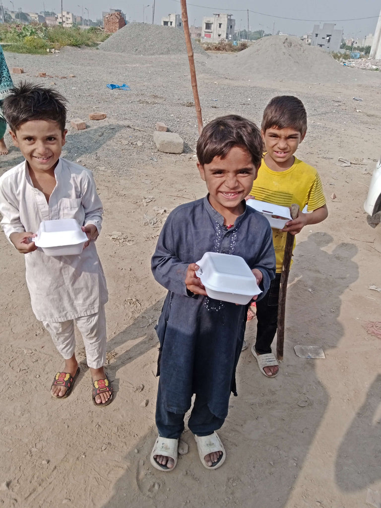 Lahore, Pakistan - Participating in Our Mobile Food Rescue Program by Distributing 53+ Traditional Sweet Rice Boxes to Less Privileged Children & Women