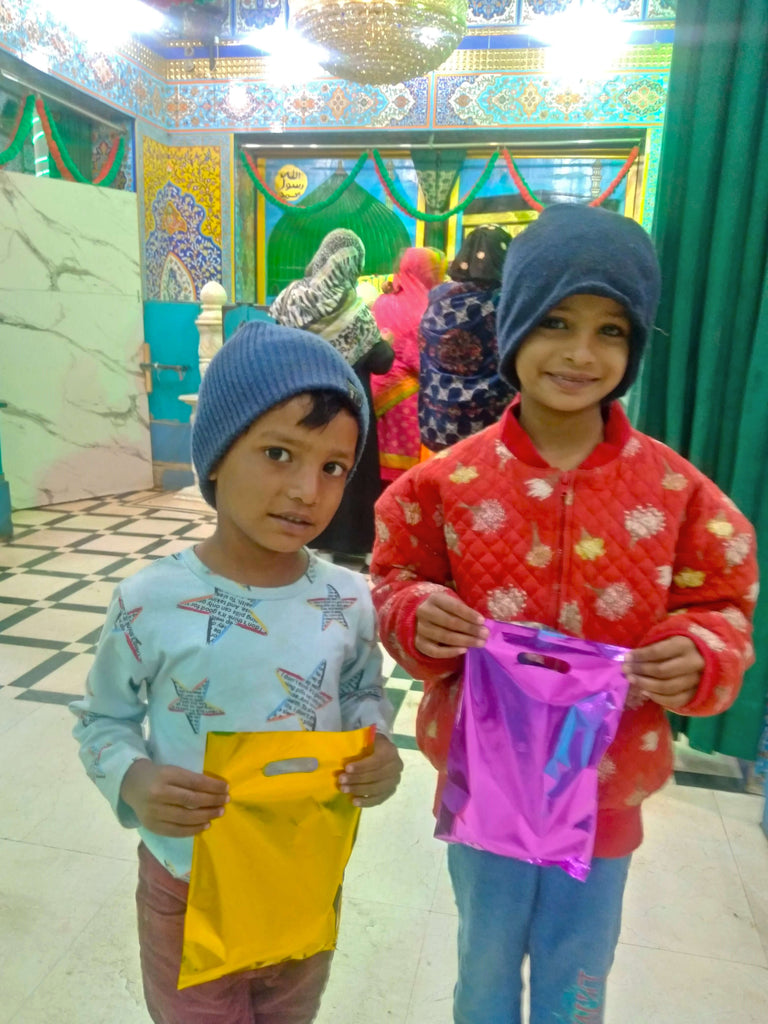 Karachi, Pakistan - Participating in Mobile Food Rescue Program by Distributing Goodie Bags Filled with Snacks & Candies to 60+ Less Privileged Children & Women at Local Community's Holy Shrine