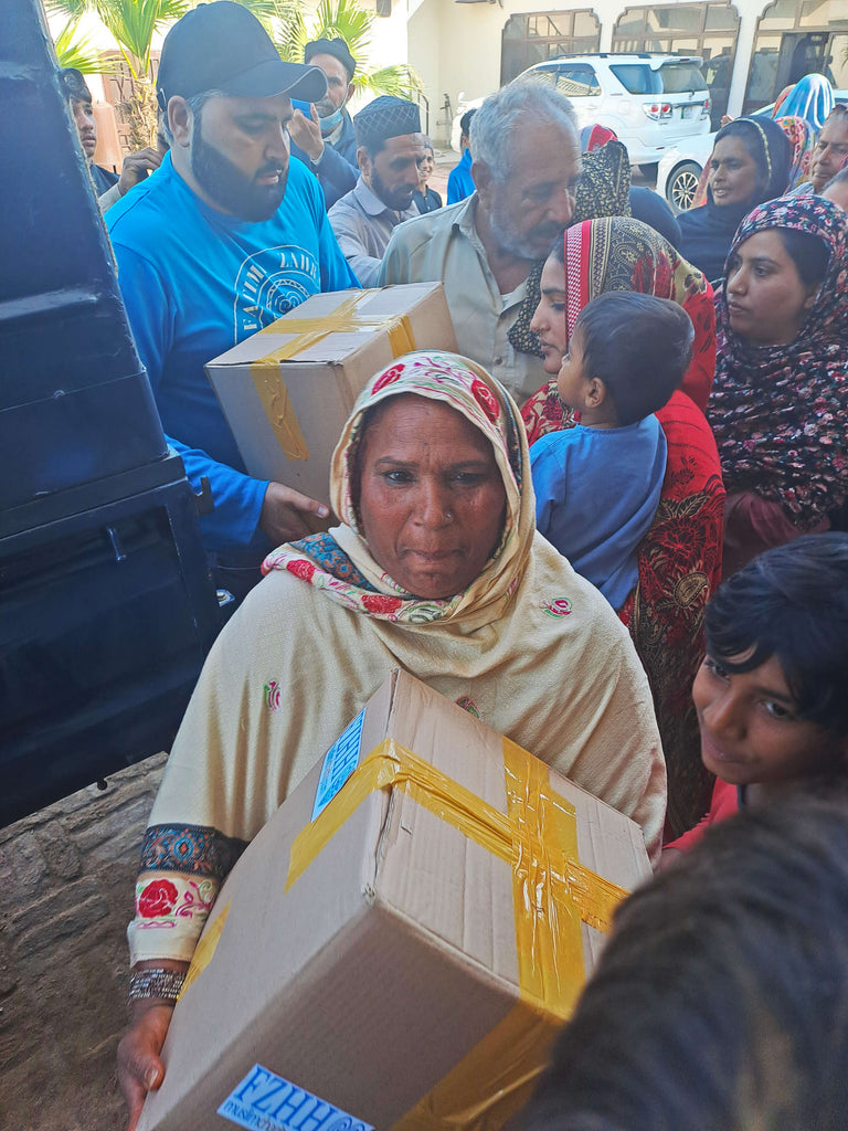 Lahore, Pakistan - Participating in Month of Ramadan Appeal Program by Serving Blessed Cake & Sweets and Distributing Blessed 30 Day Ramadan Ration to 100+ Less Privileged Families