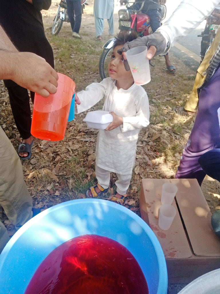 Lahore, Pakistan - Participating in Our Mobile Food Rescue Program by Preparing, Packaging & Distributing Hot Meals with Dates & Cold Drinks to 60+ Less Privileged Children & Adults