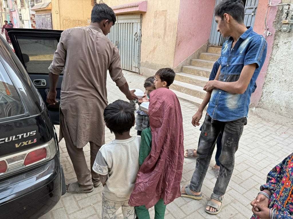 Karachi, Pakistan - Participating in Our Mobile Food Rescue Program by Preparing, Packaging, Serving & Distributing Hot Meals & Cold Drinks to 150+ Less Privileged Children, Women & Men