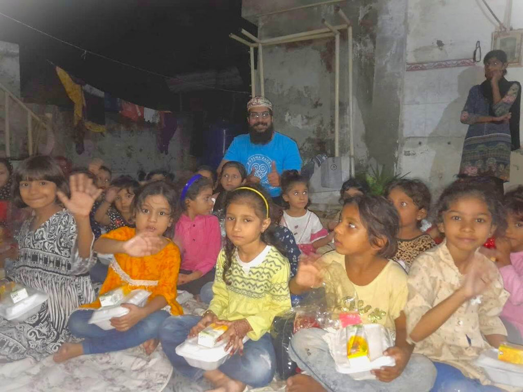 Lahore, Pakistan - Participating in Orphan Support Program & Mobile Food Rescue Program by Distributing Hot Meals with Juices & Brand New Clothes & Shoes to Beloved Orphans & Less Privileged Children