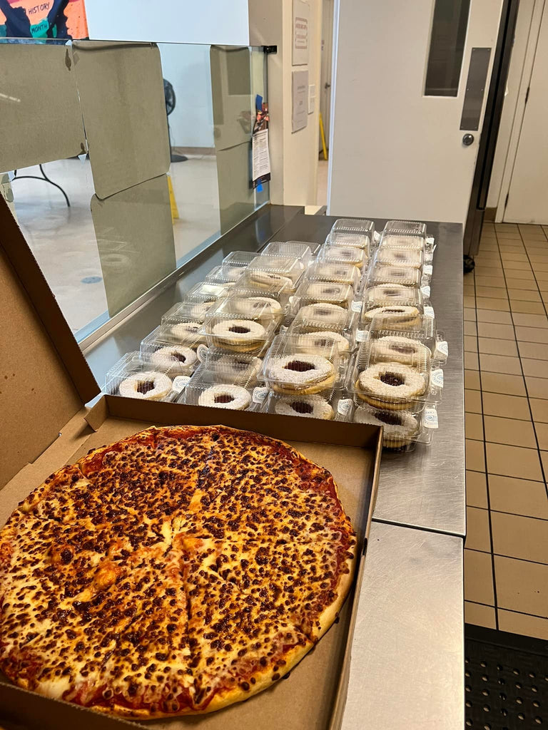 Honoring URS of Sayyiditina Zainab (AS) by Serving Hot Pizza & Homemade Gourmet Baked Sweets at Homeless Shelter – LA