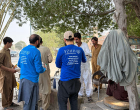 Karachi, Pakistan - Participating in Our Mobile Food Rescue Program by Preparing, Packaging, Serving & Distributing Hot Meals & Cold Drinks to 300+ Less Privileged Children, Women & Men