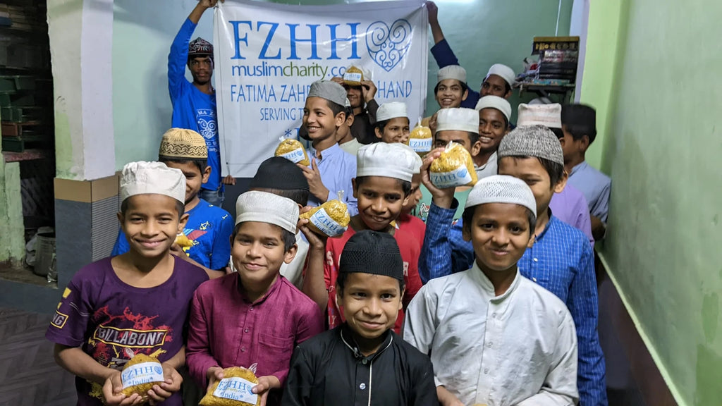 Hyderabad, India - Participating in Mobile Food Rescue Program by Distributing Hot Meals to Children at 2 Local Madrasas/Schools